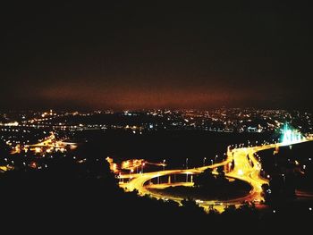 High angle view of illuminated buildings in city at night