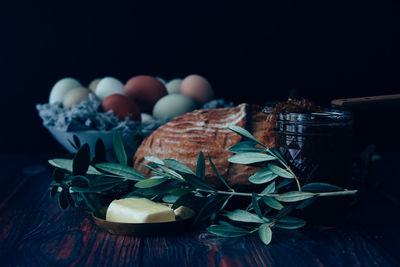 Close-up of food on table against black background
