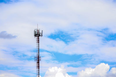 Low angle view of communications tower against sky