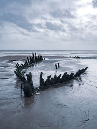 Scenic view of sea against sky during winter
