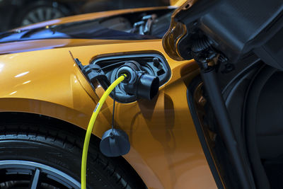 Close-up of car getting refueling