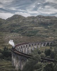 Scenic view of train on viaduct