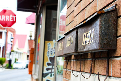 Old mailboxes mounted on brick wall