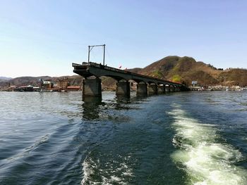 Bridge over river against sky