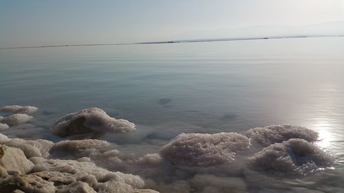 High angle view of sea shore against sky