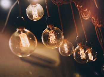 Low angle view of illuminated light bulb