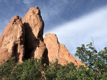 Low angle view of rock formation against sky