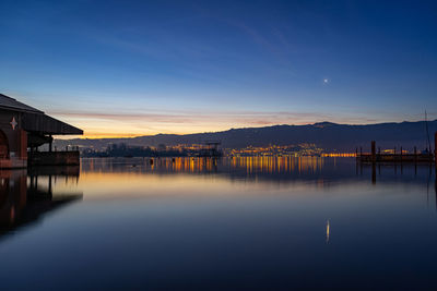 Scenic view of river against sky during sunrise 