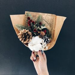 High angle view of person holding ice cream against black background