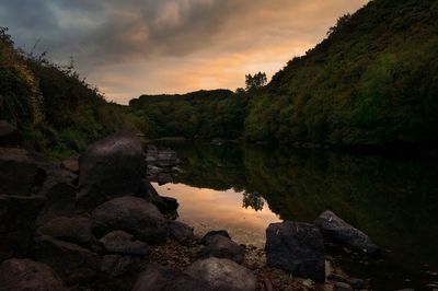Scenic view of lake against sky during sunset