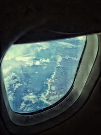 Cropped image of airplane window