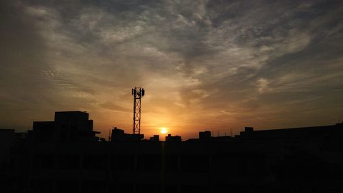 Silhouette of city at sunset