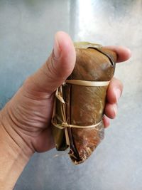 Close-up of hand holding ice cream