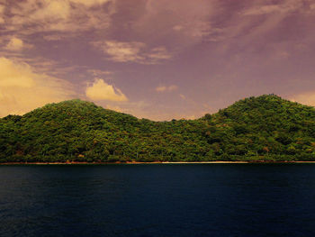 Scenic view of sea against cloudy sky