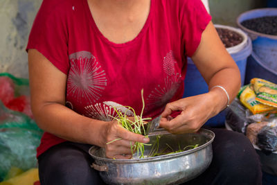 Midsection of woman holding food