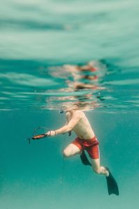 Man swimming in sea