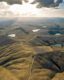 Aerial view of landscape against sky during sunset