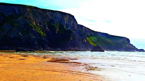 Scenic view of beach against sky