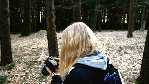 Rear view of woman in forest