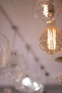 Low angle view of illuminated light bulb