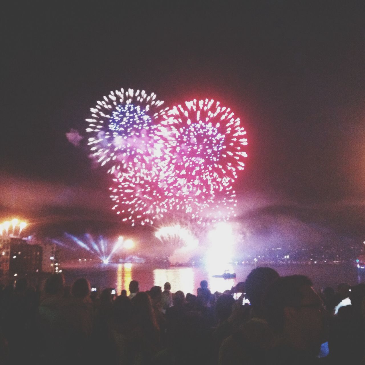 illuminated, night, arts culture and entertainment, celebration, event, firework display, exploding, large group of people, firework - man made object, lifestyles, sky, leisure activity, enjoyment, glowing, men, fun, sparks, firework, person