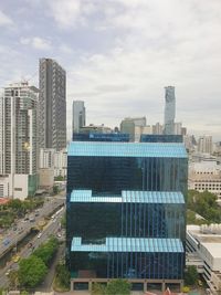 Modern buildings in city against sky