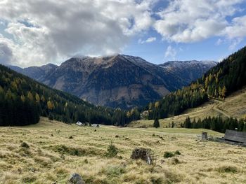 Scenic view of landscape and mountains against sky