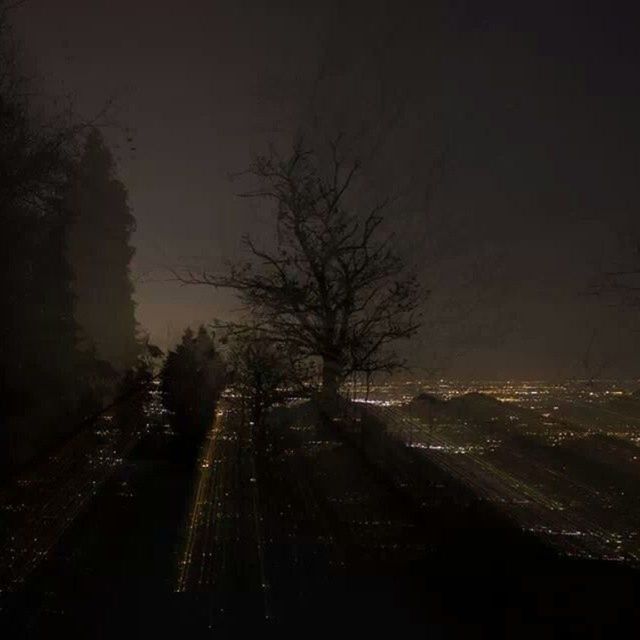 night, illuminated, road, tree, transportation, street, dark, city, sky, the way forward, copy space, weather, no people, outdoors, car, nature, building exterior, built structure, clear sky, motion