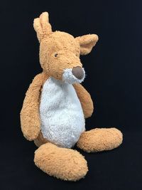 Close-up of stuffed toy against black background