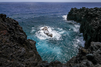 Scenic view of rocks in sea