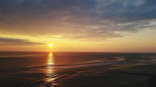 Scenic view of sea at sunset