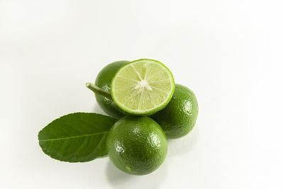 Close-up of lemon slice over white background