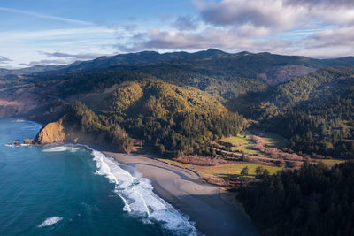 High angle view of sea and mountains against sky, oregon coast