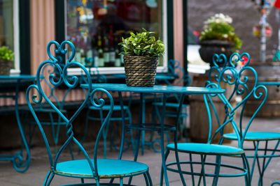 Chairs and table arranged at sidewalk cafe