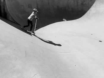 Girl skateboarding at park