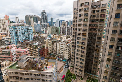 High angle view of buildings in city against sky