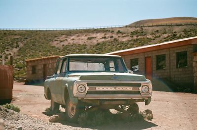 Vintage car on land against clear sky