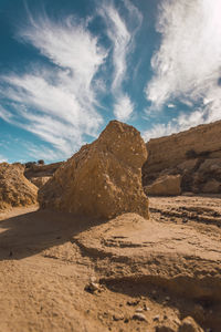 Rock formations in desert against sky