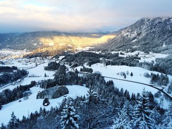 Scenic view of snow covered mountains against sky