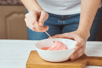 Midsection of man preparing food on table