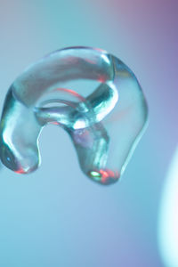 Close-up of water drop on blue background