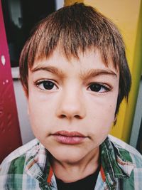 Close-up portrait of boy at home