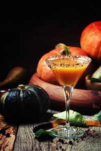 Close-up of drink on table against black background