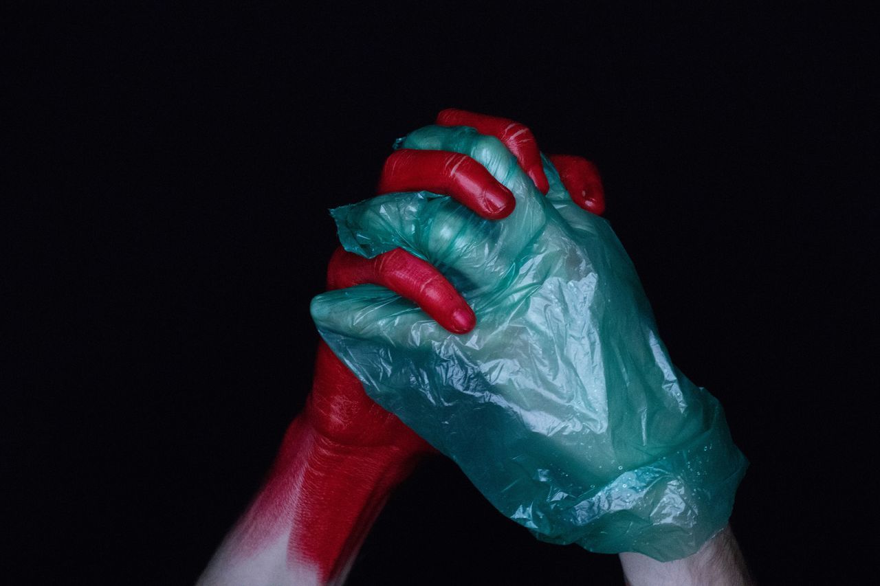 human hand, human body part, studio shot, hand, indoors, red, black background, one person, close-up, body part, copy space, finger, human finger, green color, holding, protective glove, paint, occupation, unrecognizable person, human limb