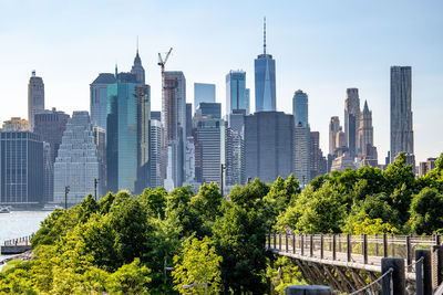 Panoramic view of trees and buildings against sky