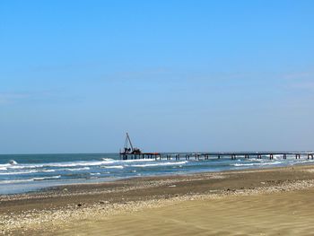 Scenic view of beach against clear sky