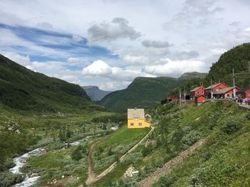 Scenic view of mountains against cloudy sky