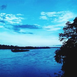 Scenic view of sea against blue sky