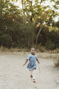 Full length of a girl walking on land