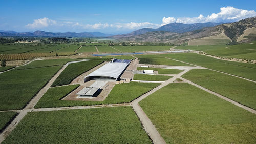 Scenic view of green landscape against sky